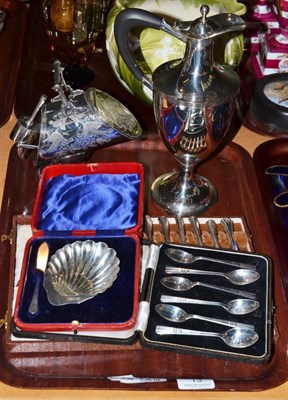 Lot 13 - Six silver teaspoons, butter dish and knife, plated claret jug, sugar helmet, etc