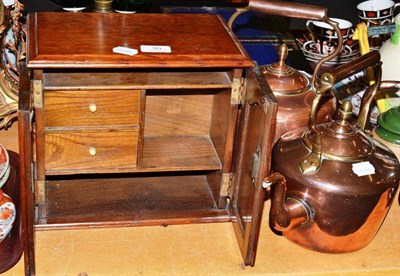 Lot 30 - A small oak smoker's cabinet, two copper tea kettles, a brass oil lamp, a pair of small brass...
