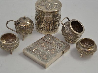 Lot 109 - An Indian silver metal card case, a four piece cruet and a box and cover