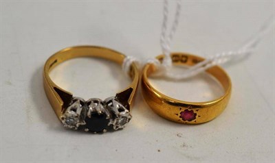 Lot 120 - An 18ct gold ruby ring and a 9ct gold sapphire and diamond ring