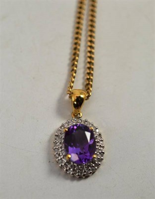 Lot 123 - A 9ct gold amethyst and diamond pendant on chain