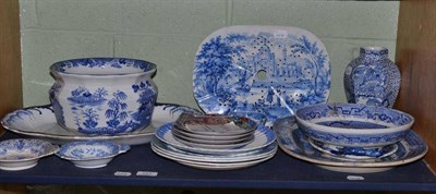 Lot 127 - A shelf lot of blue and white including a strainer, 'Willow' pattern dishes and a vase