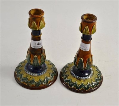 Lot 145 - A pair of Doulton Lambeth candlesticks (a.f.)