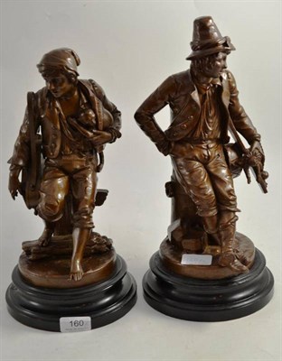 Lot 160 - A pair of French bronzed spelter figures of street entertainers