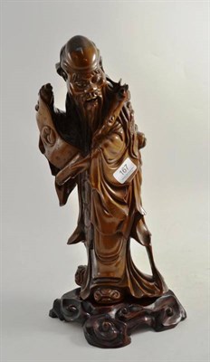 Lot 167 - A Chinese large carved hardwood figure of Shou Lao on a later stand