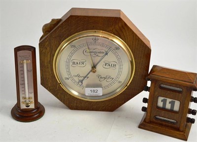Lot 182 - An oak aneroid barometer with carved mouse, desk thermometer signed Negretti and Zambra and an...