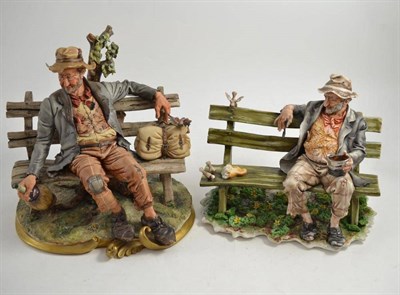 Lot 204 - Two Capodimonte figures of tramps on benches