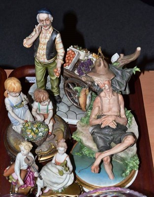 Lot 208 - Five Capodimonte figures, fruit seller, a fisherman, two musicians and children