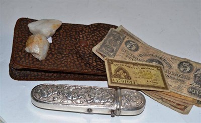 Lot 214 - Eastern embossed spectacle case, assorted foreign notes and two minerals (with provenance)