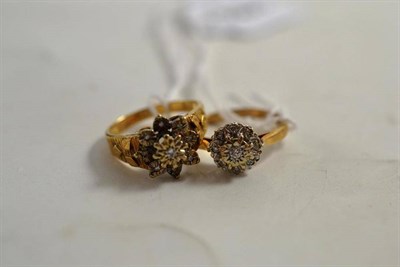 Lot 218 - A 9ct gold diamond cluster ring and another