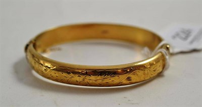 Lot 224 - A 9ct gold hollow bangle