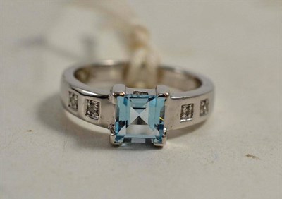 Lot 235 - A 9ct white gold blue topaz and diamond set ring