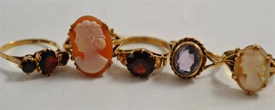 Lot 236 - Two cameo rings, two garnet rings and an amethyst ring (5)