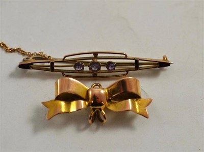 Lot 242 - A Victorian bar brooch and a bow brooch