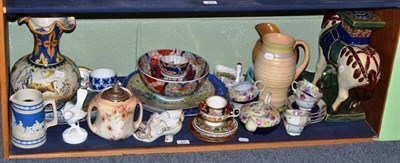 Lot 276 - A shelf of decorative ceramics including a large Tang style figure of a horse, a Majolica vase,...