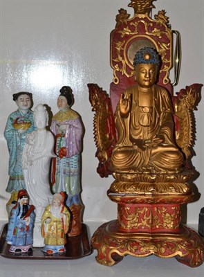 Lot 279 - A large red and gilded wood figure of Buddha on a throne; two pairs of Chinese figures and a...