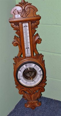 Lot 281 - A Victorian blond oak aneroid barometer/thermometer