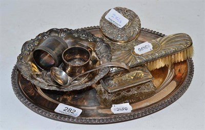 Lot 282 - A white metal dish, silver topped jars, silver ladle etc