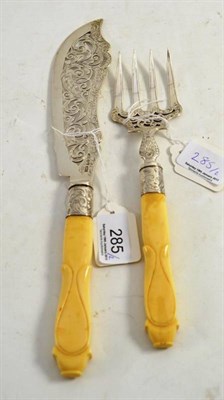 Lot 285 - A pair of silver and ivory fish servers