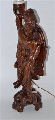 Lot 308 - A large Chinese carved wood figural lamp base