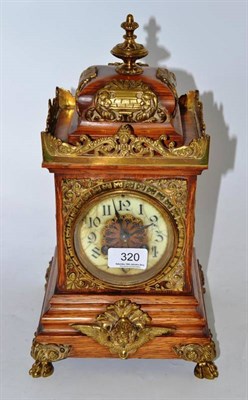 Lot 320 - A brass mounted oak mantel clock