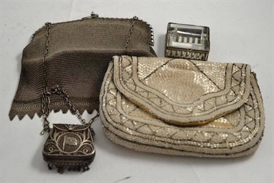 Lot 323 - Two silver purses, beadwork purse and a silver and glass desk stamp roller