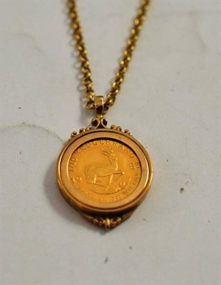 Lot 336 - A 1985 one tenth Krugerrand coin pendant on chain