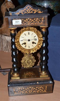 Lot 351 - An inlaid portico striking mantel clock.