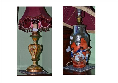 Lot 364 - A painted wooden lamp and a ceramic Banco ware lamp with raised figures of children