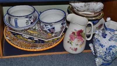 Lot 373 - A shelf of decorative ceramics including a large Majolica charger, toilet ewer and basin and a meat