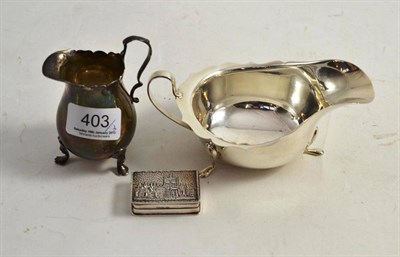 Lot 403 - A silver cream jug, silver sauce boat and a Sterling snuff box (3)