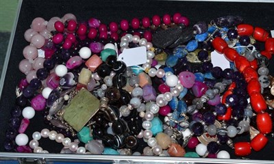 Lot 410 - A case of bead necklaces comprising cultured pearls, quartz, agates, etc