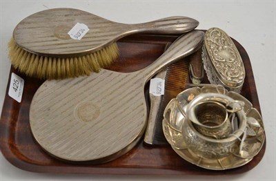 Lot 425 - A small silver bowl, a pin box, a small bowl, a jug, sugar tongs, a napkin ring, a three piece...