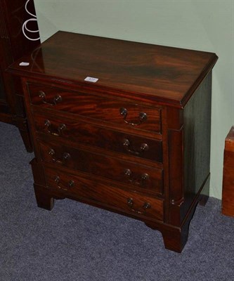 Lot 477 - A Georgian style miniature mahogany four height chest