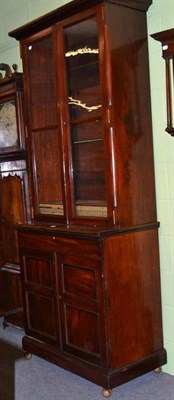 Lot 480 - A Victorian mahogany bookcase with cabinet base