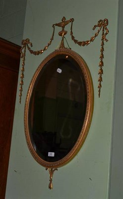 Lot 486 - A Neo-classical style gilt gesso framed oval mirror