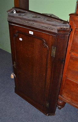 Lot 497 - A 19th century oak corner cupboard