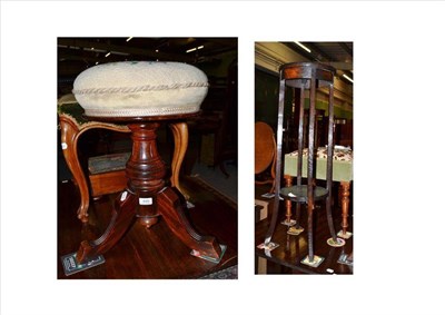 Lot 499 - A walnut piano stool with woolwork seat and an oak two tier jardiniere stand