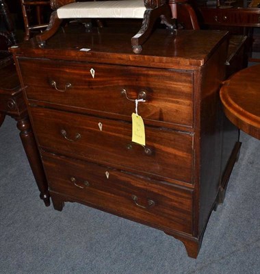 Lot 529 - A Georgian mahogany three height chest