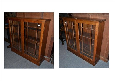 Lot 538 - A pair of Edwardian oak glazed bookcases