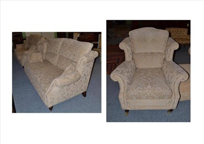 Lot 545 - A modern three piece suite comprising a chair and two settees