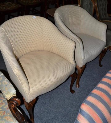 Lot 553 - A pair of tub shaped armchairs