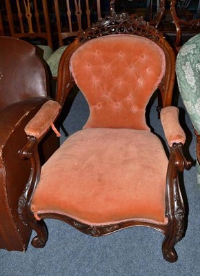 Lot 558 - A Victorian rosewood open armchair upholstered in pink velour