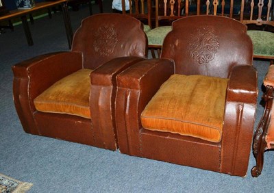 Lot 559 - A pair of embossed leatherette armchairs