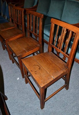 Lot 563 - A 19th century set of four provincial oak dining chairs