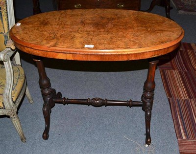 Lot 571 - A Victorian figured walnut oval window table