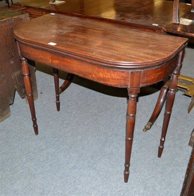 Lot 583 - A George III mahogany D-shaped fold over tea table