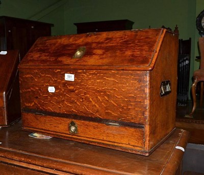 Lot 591 - A late Victorian/Edwardian oak stationary cabinet