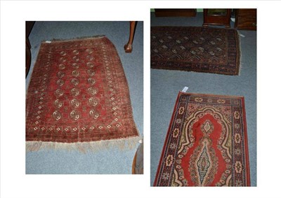 Lot 595 - An Afghan wool rug, a Caucasian rug and a Persian style runner