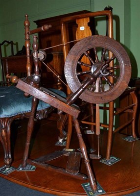 Lot 602 - A 19th century turned elm and fruit wood spinning wheel